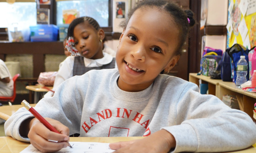 Catholic school student working in classroom