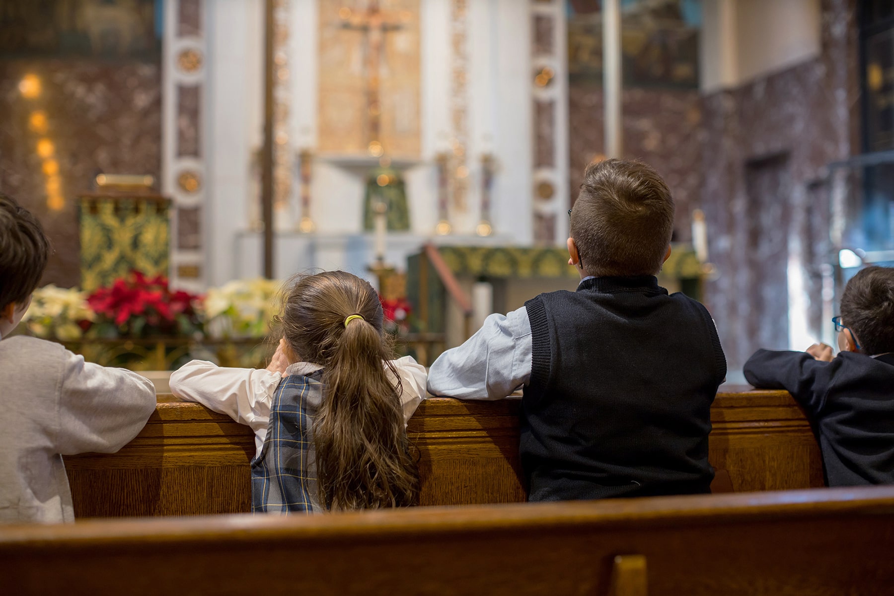 students praying in church